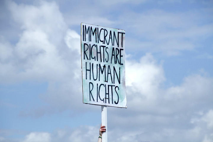 Banner saying "Immigrant rights are human rights"